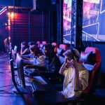 Focused gamers in a high-tech arena compete intensely, showcasing esports fervor. — Can You Win Real Money In The fun88 app