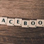 Scrabble tiles spelling 'Facebook' on a wood background, symbolizing social media. — Get Noticed for the Right Reasons - Secu