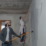 A couple painting a room together, highlighting teamwork in home renovation. — Particulars About On line Data