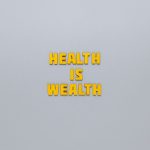 Inspirational phrase 'Health is Wealth' in bold yellow letters on a neutral gray background. — Step-by-Step Process for Order
