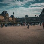 Tourists exploring the Louvre Museum in Paris, capturing the essence of travel and history. — The Best of Southern California