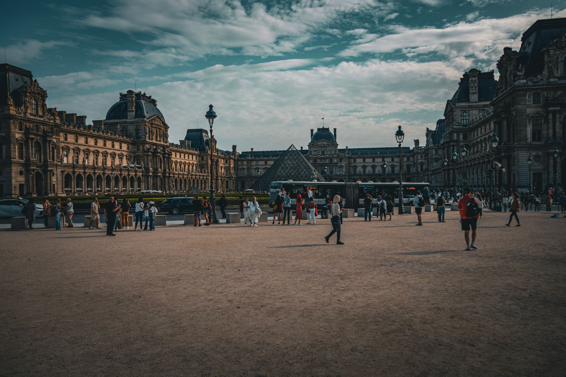Tourists exploring the Louvre Museum in Paris, capturing the essence of travel and history. — The Best of Southern California