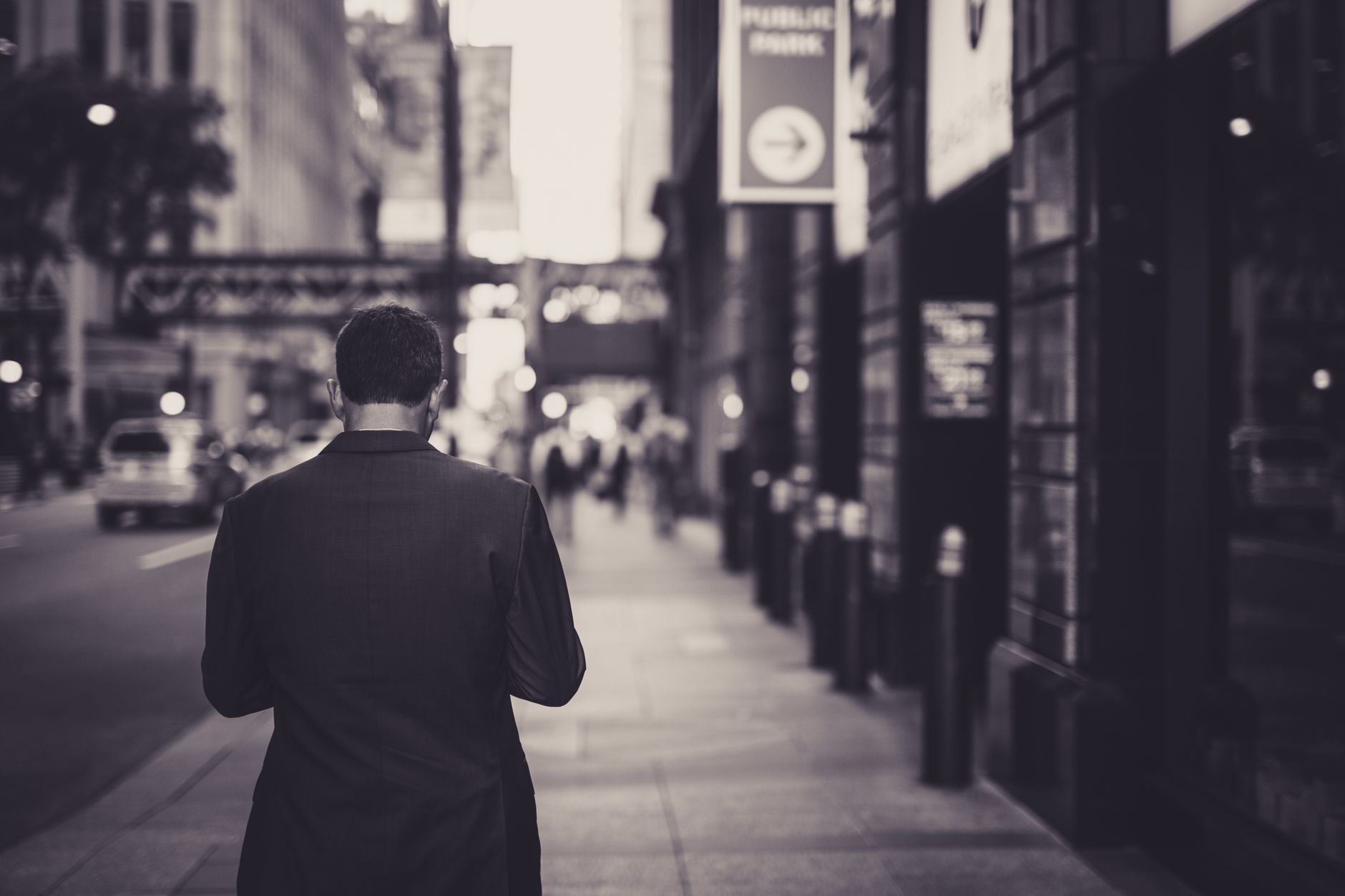 Man in a suit walking down a city street in a lonely, urban setting. — The Comprehensive Guide to Aetna Medicare Advantage 20