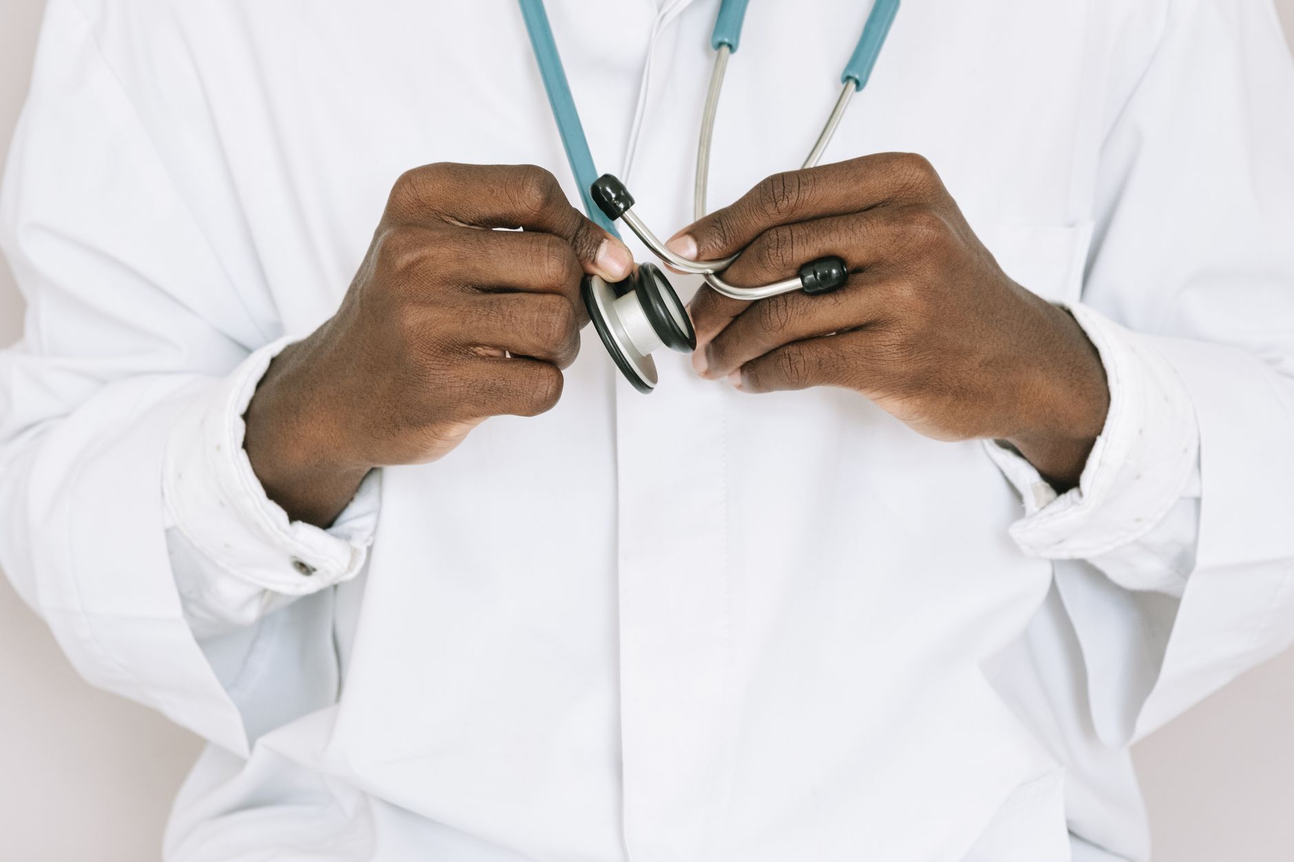A professional doctor holding a stethoscope, focusing on hands and medical tools. — The Insanity Chronicles - Episode 50