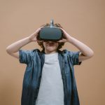 Child in studio using VR headset, engaging with modern technology on a plain background. — Variants of Holsters One Can Try